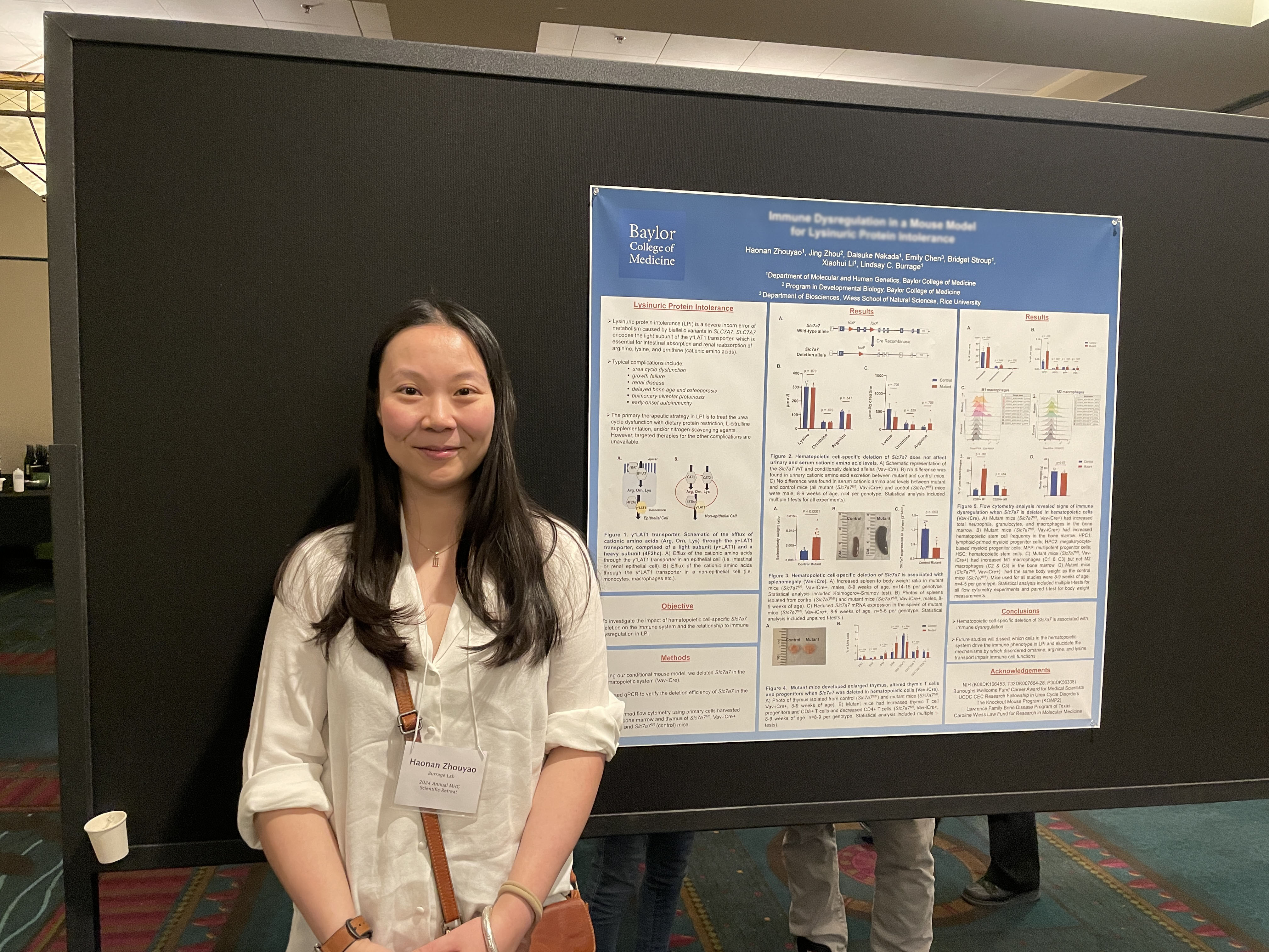 woman in front of poster