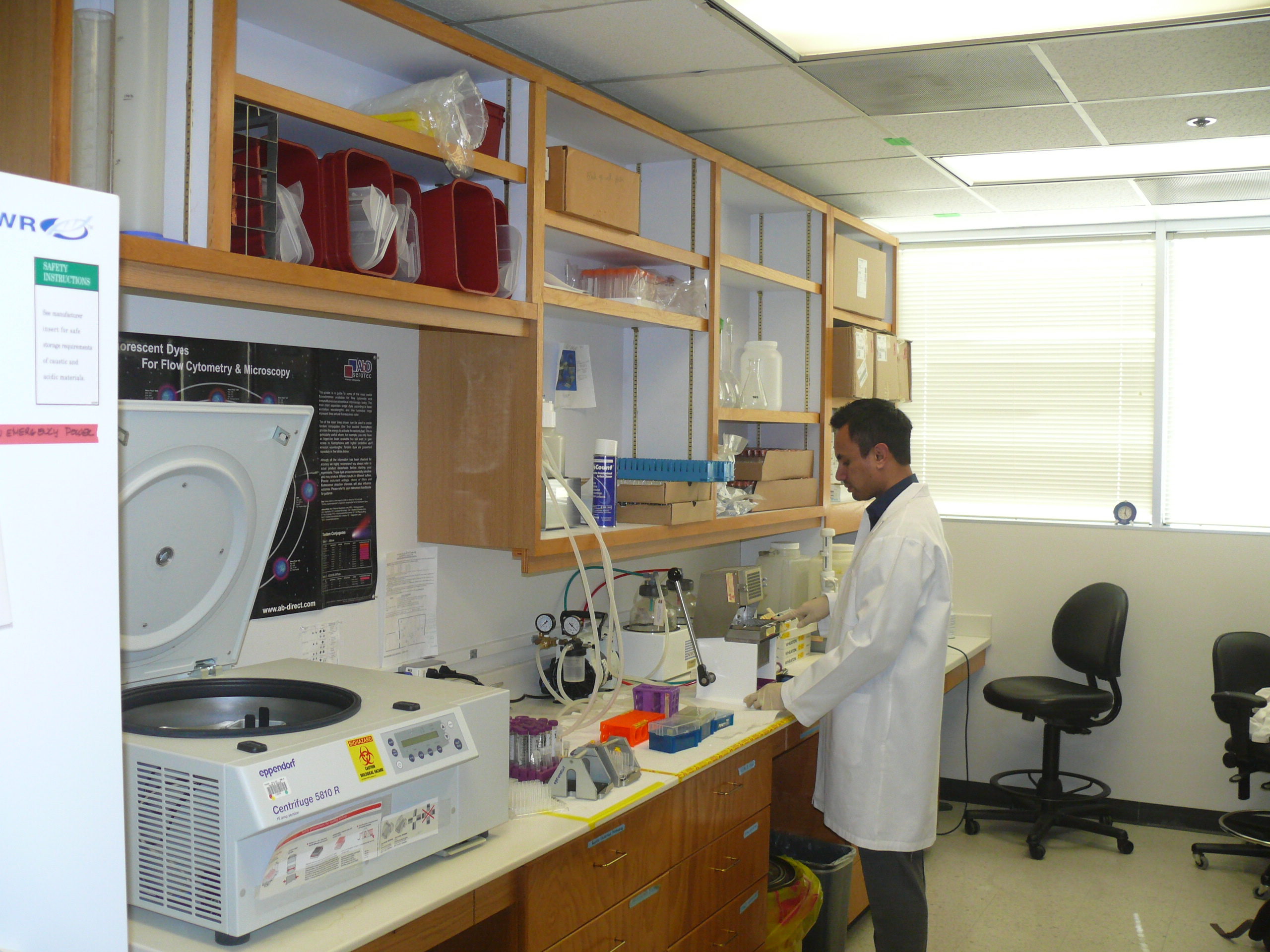 man standing in a lab with a white coat on