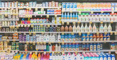 Shelves full of perishable products in a grocery store.