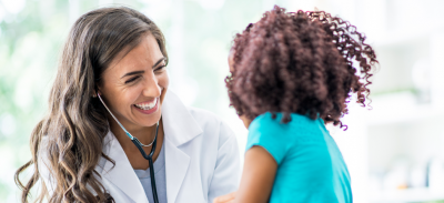 A doctor meeting with a young patient.