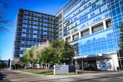 Baylor St. Luke's Tower One, a large windowed building with a blue sky behind it.