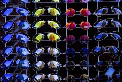 Photo of sunglasses on a display wall