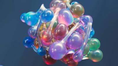 An artists rendition shows a "biological soup" of gene-regulating proteins. The current study shows that the noodle-like regions use a structured "bridge" protein to carry out gene activation.    