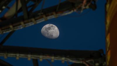 Moon Seen Shining on Full Artemis II Stack at Launch Pad 39B