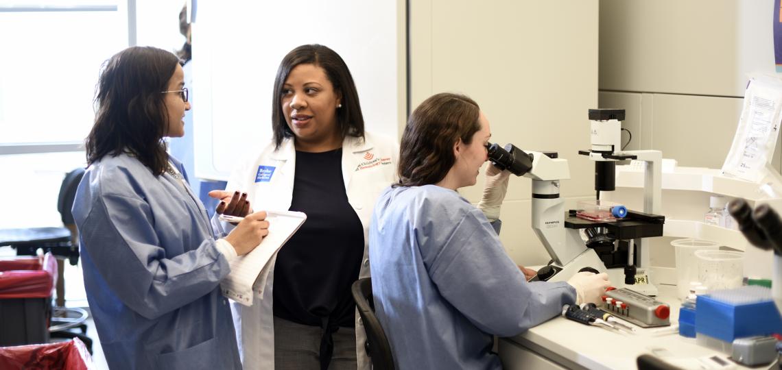 A team of doctors discuss in an office