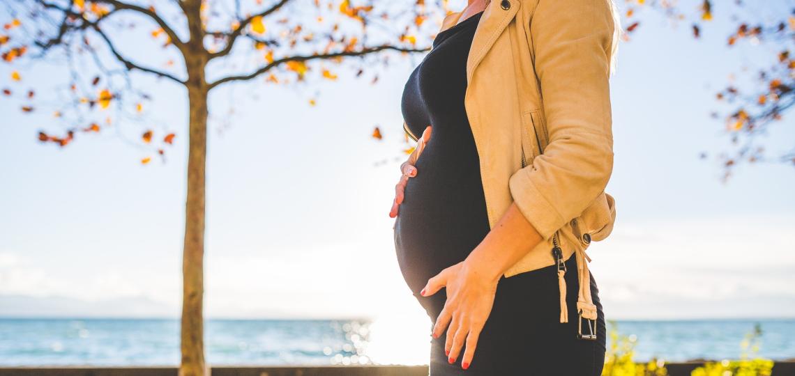 Pregnant mother walking outside