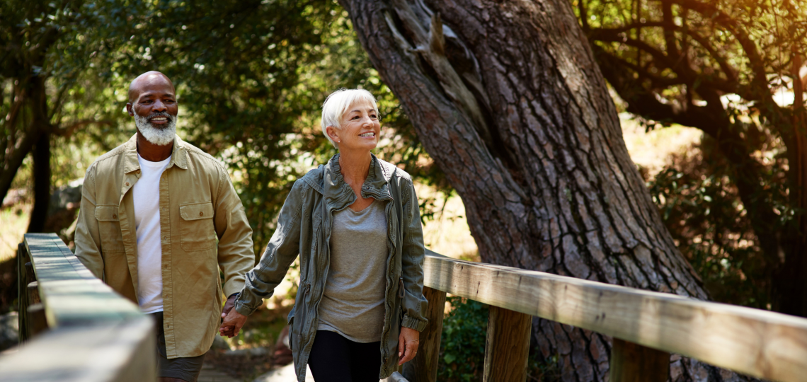 A man and woman walking hand in hand.