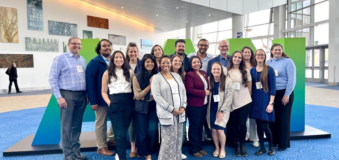 group of people smiling at a theatre