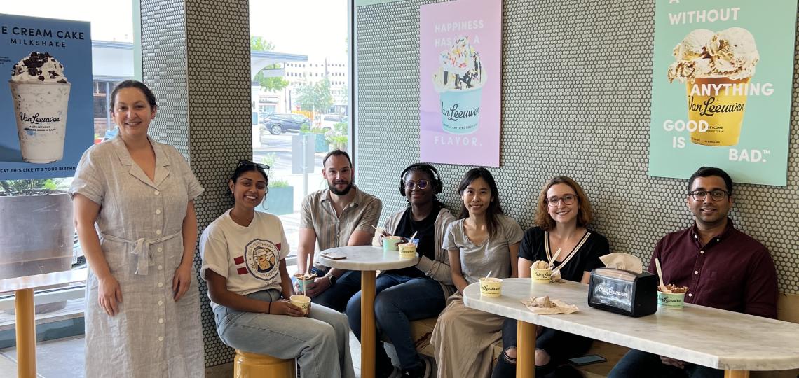 a group of people sitting in an ice cream shop