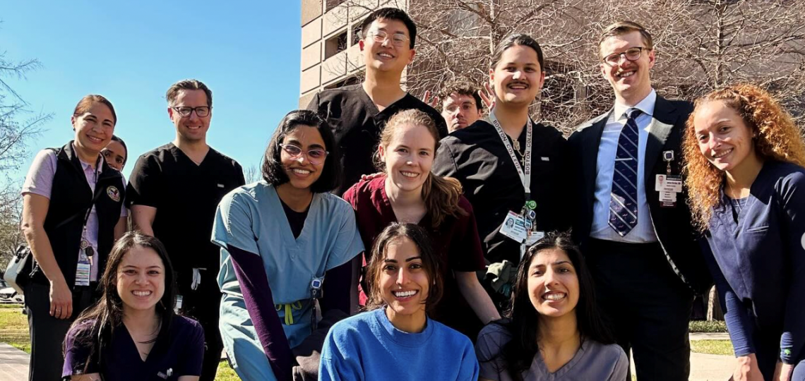 group of residents smiling outside