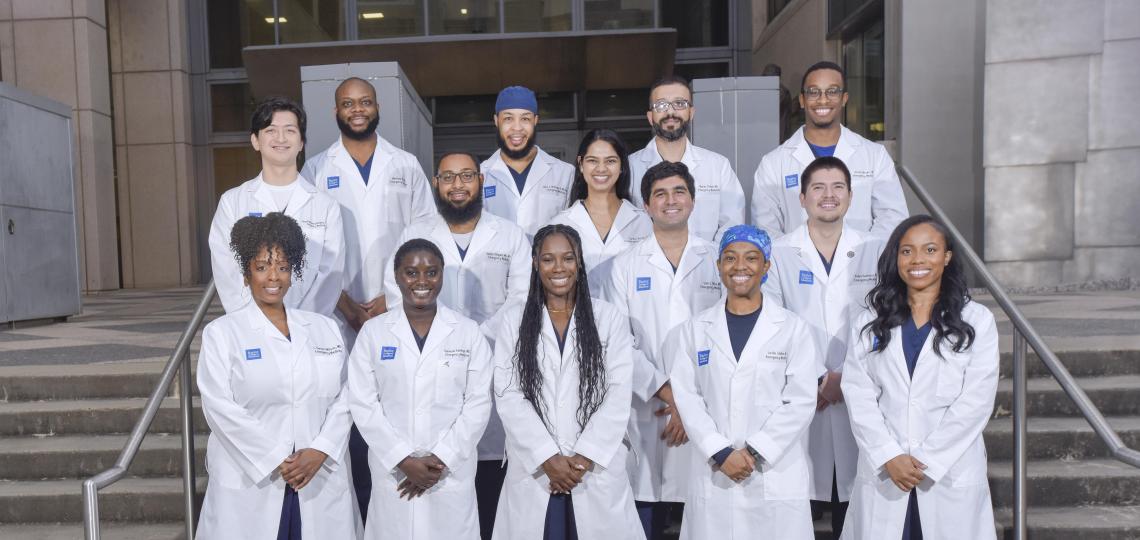 a group of residents smiling in steps