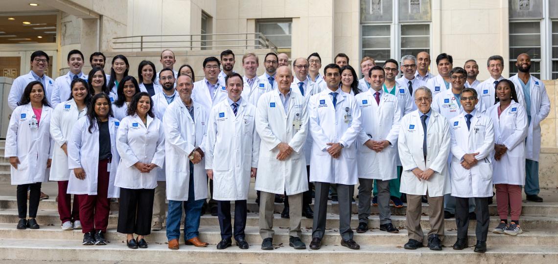 group of people standing in front of a building