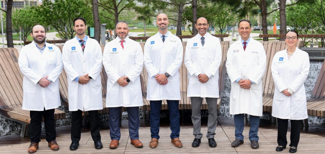 group of doctors standing outside smiling