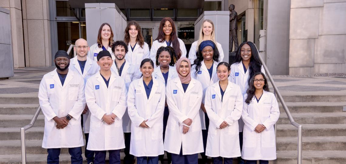 group of doctors standing on steps and smiling
