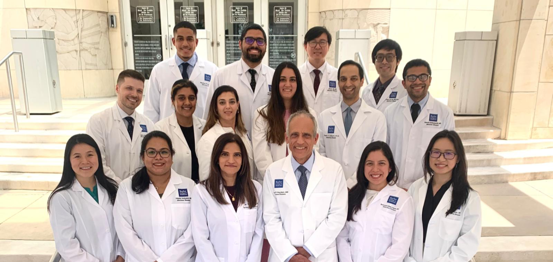 group of doctors standing on stairs smiling