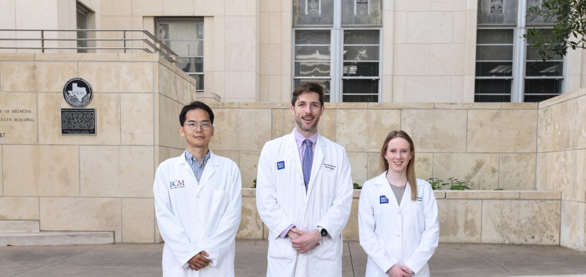 3 doctors standing side-by-side, smiling