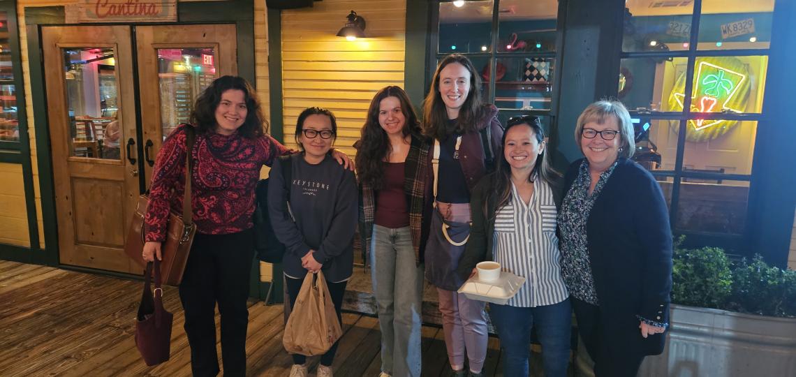 Lab group with Janice Cowden at dinner