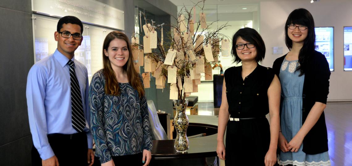 From left: Lakshay Jain, Malia Gresham, Rui Zheng and Susan Xie standing next the the Willed Body Memorial Tree.