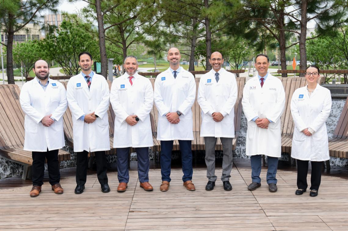 group of doctors standing outside smiling