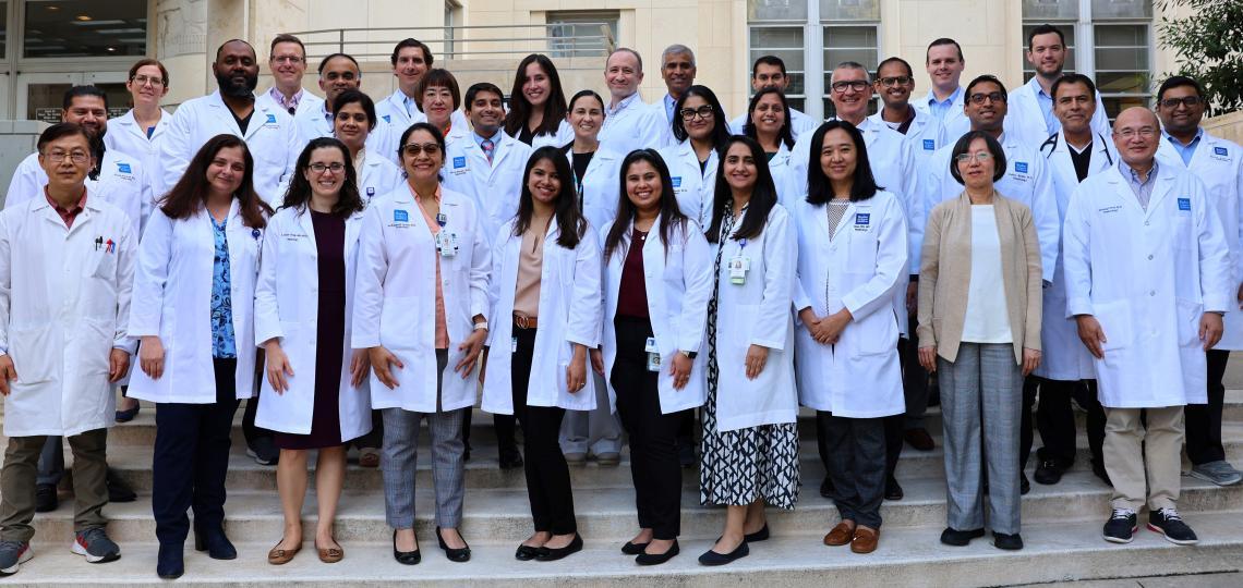 large group of doctors standing together smiling