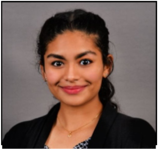 woman with her hair in a ponytail smiling