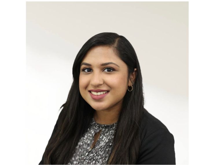 woman with long black hair smiling
