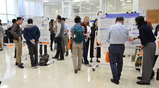 people looking at various medical poster boards
