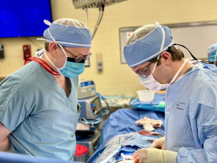 Surgery residents operating