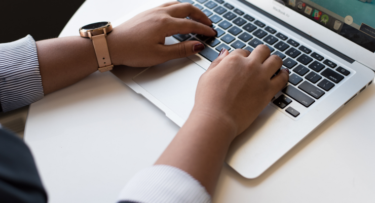 close-up of person using a laptop