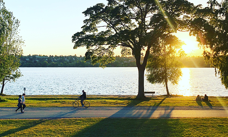 People practicing social distancing at a park.