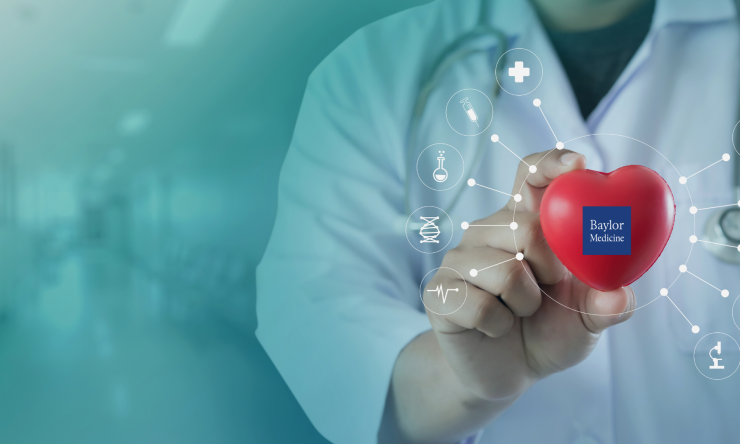 A hand holding a red heart with the Baylor medicine logo.