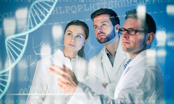 Three researchers standing amongst graphic illustrations of genetic information that circle their bodies