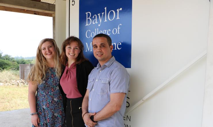 Three fellows standing outside