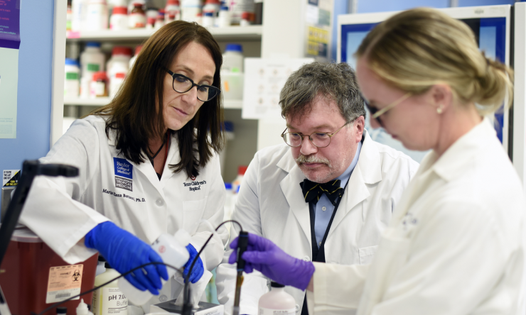 Three doctors working together with research samples
