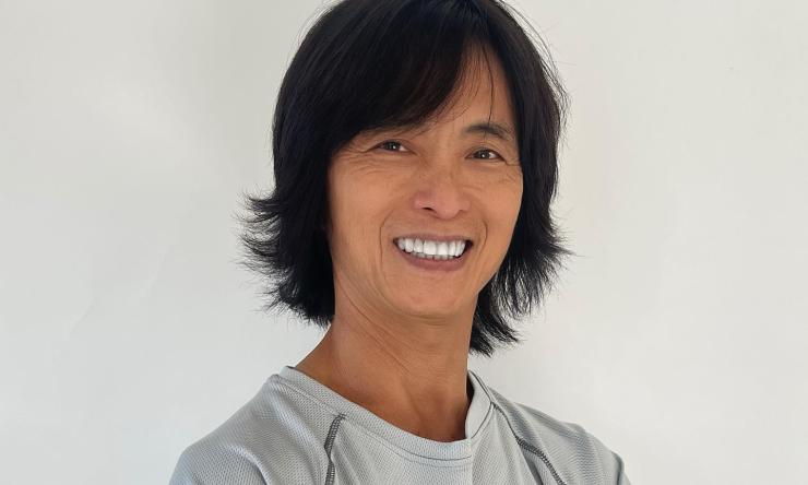 man in grey long sleeve smiling