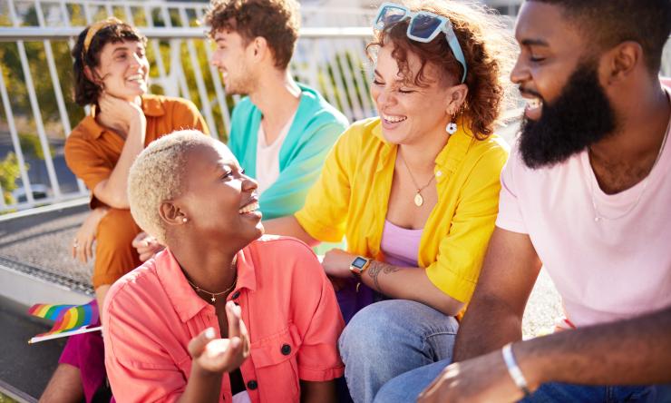 a diverse group of people smiling and laughing