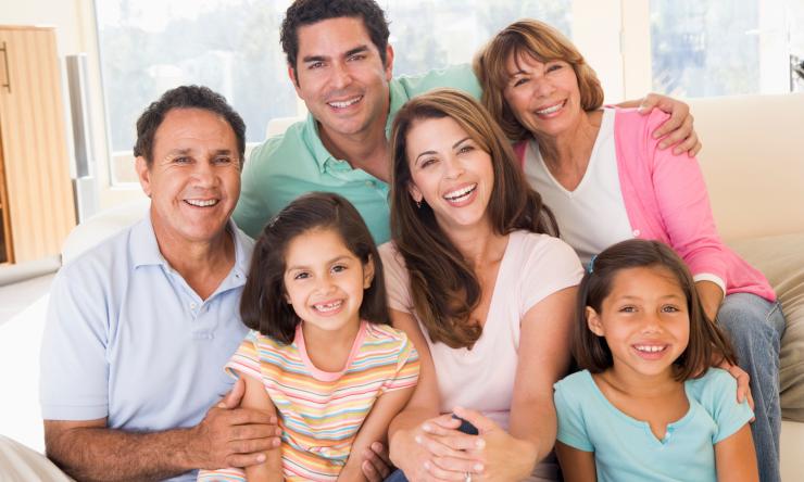 family smiling at camera