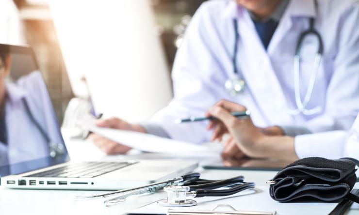 doctors looking at laptop