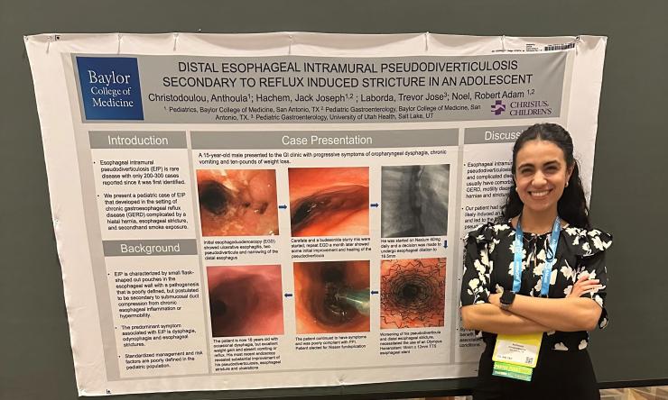 woman standing in front of poster board