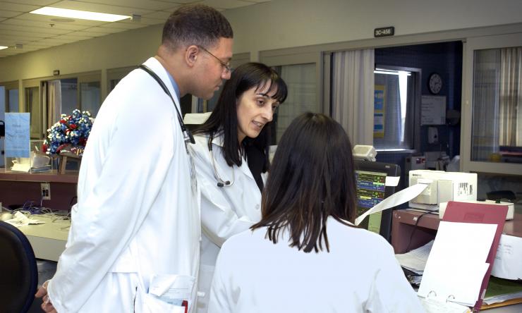 Dr. Biykem Bozhurt discussing a patient case with other Baylor College of Medicine faculty physicians.