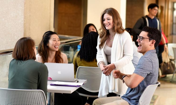 Graduate students gathering on campus.